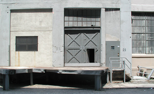 Grey walls and
a four piece grey wooden door.