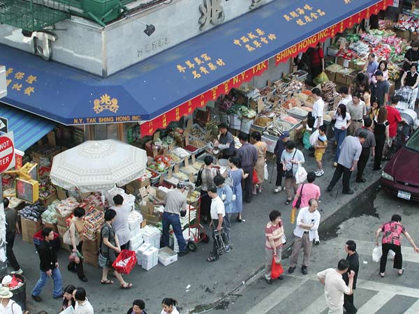 A corner store, busy with patrons.