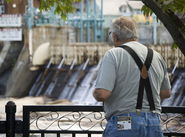 A tourist gazes at the falls.