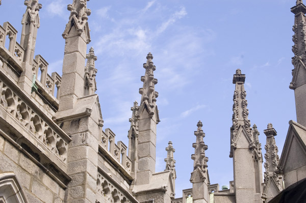 Numerous church spires reach up to a blue sky.