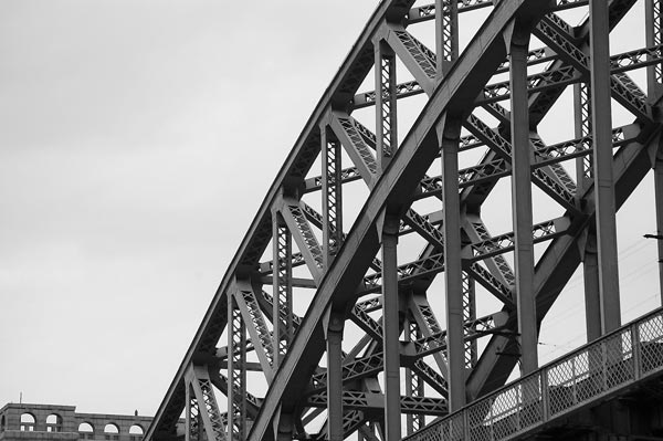 A steel arch bridge with a network of girders and struts.