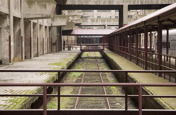 An atrium with railroad tracks, formerly for shipping.