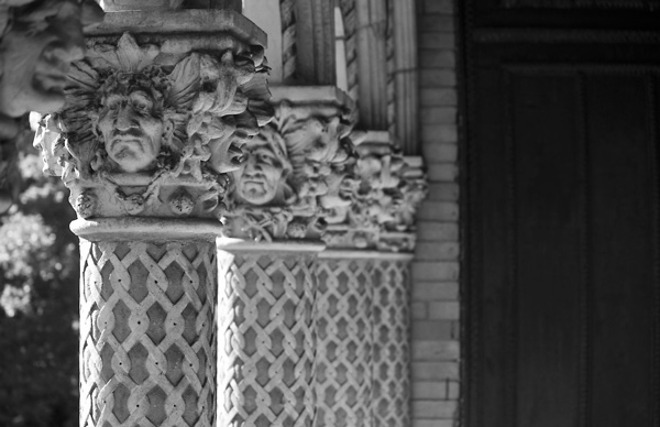 Pillars with Native American faces and braids.