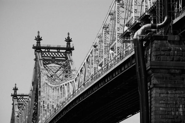 The bridge's span shows a complex network of steel beams.