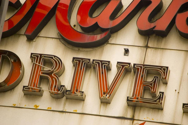 Red neon letters on an old diner sign.