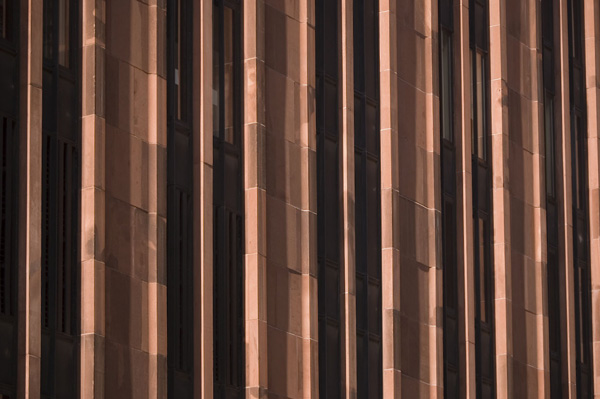 A building's side consists of vertical lines.