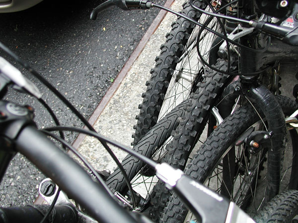 Tires of a half dozen bikes are jumbled together.