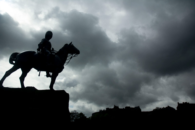 The picture shows a statue of a soldier on horseback, wearing a tall bearskin hat.