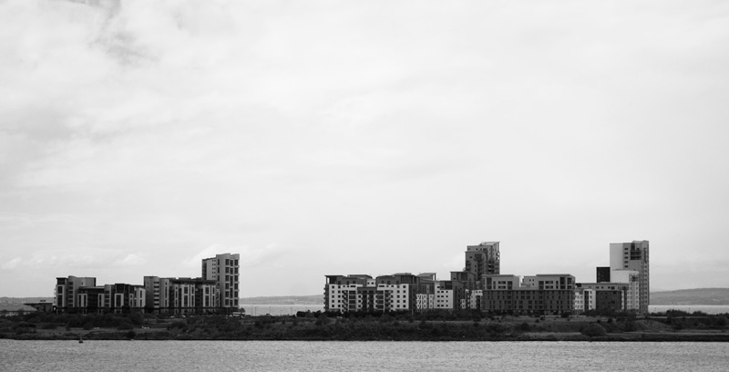 The photo shows clusters of apartment buildings on a small peninsula in Leith.