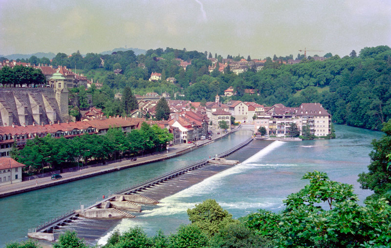 The photo shows Switzerland's Aare River as it runs past buildings in Bern.